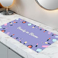 Dual-Sided Waterproof Synthetic Leather Makeup Mat for Desk, Makeup Station, Crafts, Multi-Use Scratch & Stain Resistant Surface Protector Pad for Vanity, Desktop, Craft Table (Purple Cartoon)